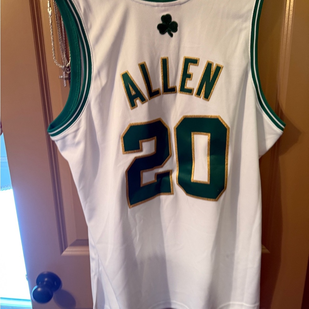 White Basketball Jersey with Green and Gold Accents